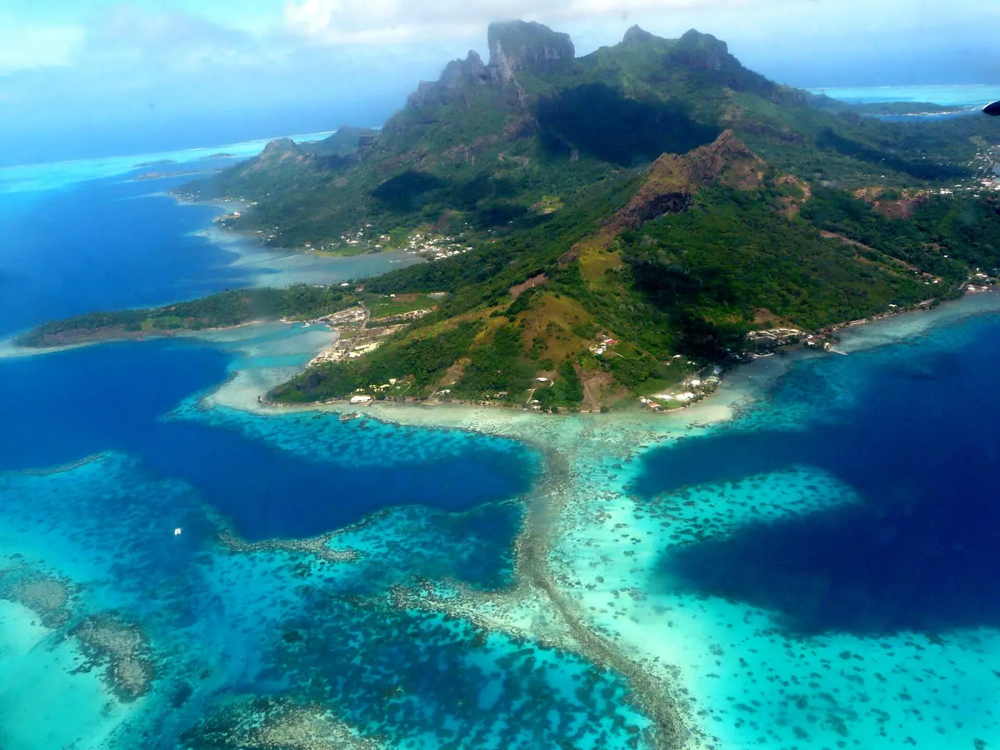 Aerial view of a Polynesian island and its lagoon